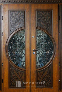 Парадная дверь с коваными элементами №101 - фото вид снаружи